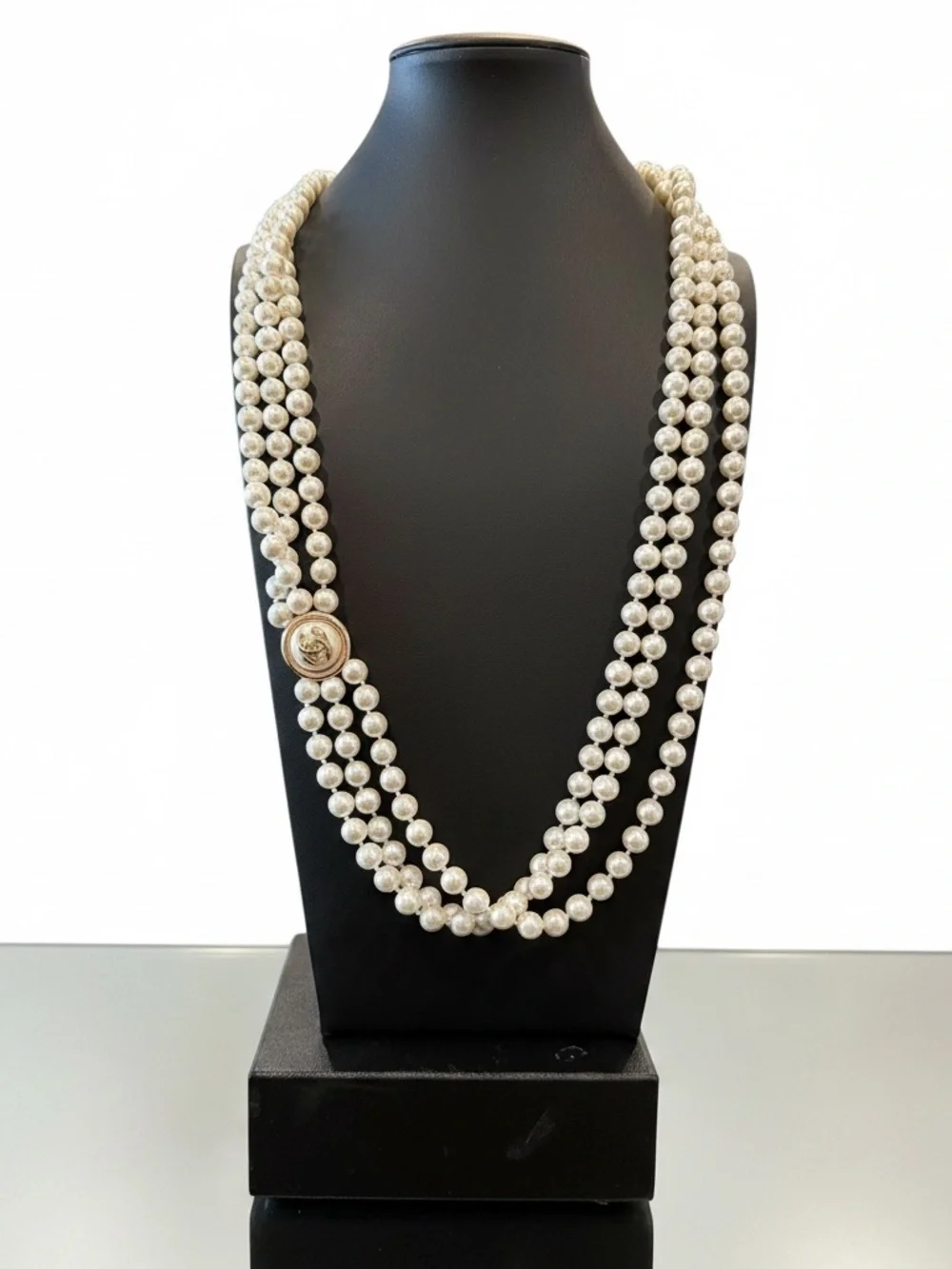 CHANEL Ivory Triple-Strand Faux Pearl Necklace with Signature Medallion